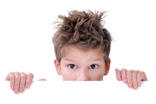 Cute Young Boy Hiding Behind An Empty Placard
