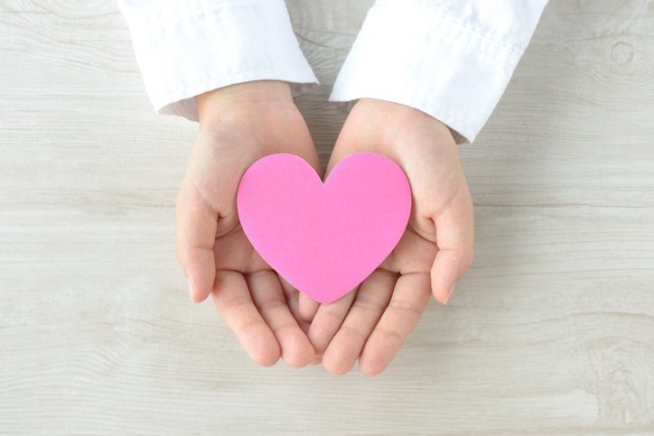 Heart object covered by child's hands